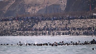 Thousands of migrants storm Ceuta border from Morocco