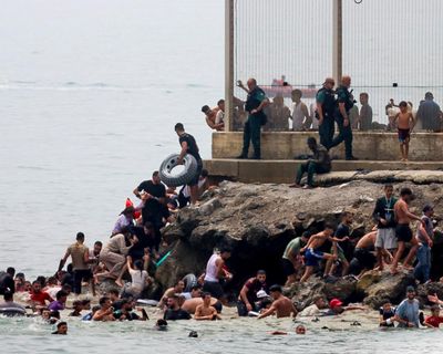 Spain sends extra troops and police to Ceuta after thousands of migrants arrive