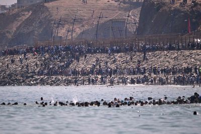 Nine deaths in Ceuta as thousands of migrants breach Morocco’s border with Spain