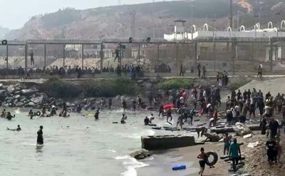 Hundreds of migrants flood into Spain's Ceuta exclave from Morocco