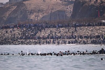 Spain deploys army as thousands of migrants swim from Morocco into Ceuta