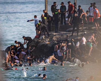 At least 57 people die as tens of thousands cross to Spanish enclave of Ceuta from Morocco