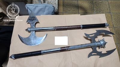 Suburban raids net crossbows, guns and battle axes