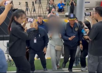 Woman courier cleared of drug smuggling in Japan returns home