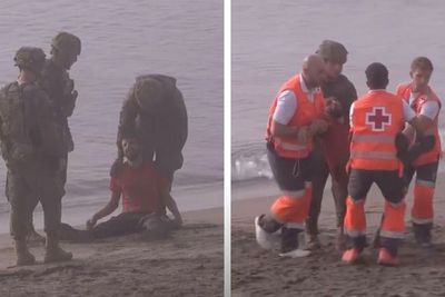 Collapsed migrant who swam to Ceuta aided by troops and medics amid border rush crisis