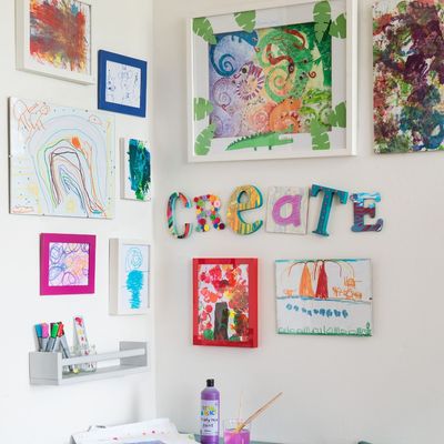 I was overwhelmed by the mountain of artwork my kids brought home from school at the end of term – here's how I'm displaying it without covering the fridge
