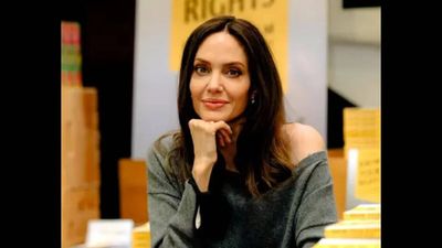 Quote of the Day by Angelina Jolie: 'If I make a fool of myself, who cares? I'm not frightened by anyone's...'-Inspiring life lessons on courage, confidence, and self-acceptance by the famous actress known for blockbuster action roles