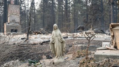 US wildfires force 65,000 to flee as hundreds of buildings burn in Spokane