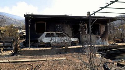 Burned homes, blackened cars: Greek wildfires leave trail of destruction in Porto Germeno