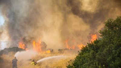 Firefighters in Greece gain ground against wildfires near Athens
