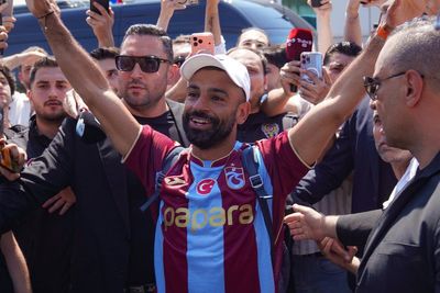 Trabzonspor fans mob Mo Salah as he arrives in Turkey wearing kit