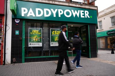 Boss of Paddy Power owner to step down after forecasts cut