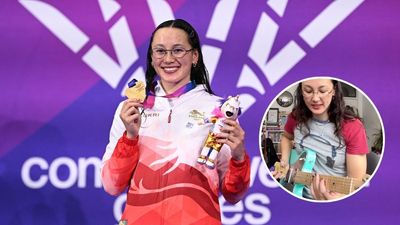 “My medal looks like a guitar pick”: Elite swimmer wins Commonwealth Games gold – then uses medal to play Megadeth