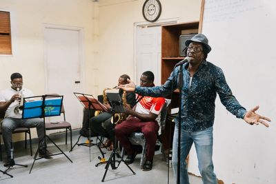 Suspended priest on tiny Caribbean island turns to music to make his voice heard