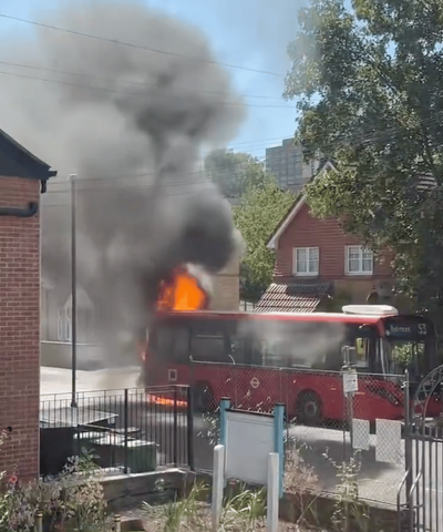 Moment bus bursts into flames on London street as firefighters rush to the scene