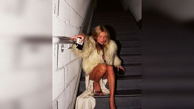 For 20 years, everyone assumed Kate Moss was drunk on that staircase. Greg Brennan, who took the photo, says she was just waiting for a car home from a party