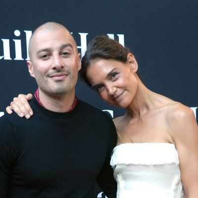 Katie Holmes Embraces a Fall 2026 Bag Trend in a Strapless White Dress for Date Night