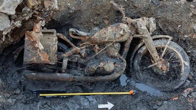 Budapest’s low Danube exposed two German soldiers and a DKW military motorcycle; mud mixed with gas oil preserved identity discs after around 80 years