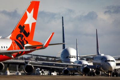 Jetstar and Qatar Airways planes in near-miss collision at Sydney airport