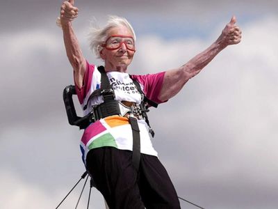 Aged 97, she strapped herself to a plane wing and flew: Betty Bromage breaks her own record in daring sky-high stunt after suffering a stroke