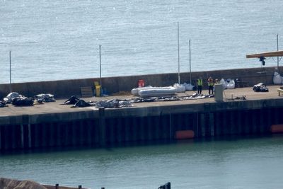 Record 230-migrant boat was buckling and nearly led to tragedy, rescuers say