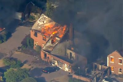 UK firefighters battle huge blaze that tore through homes as residents told to ‘stay away’: Weather latest