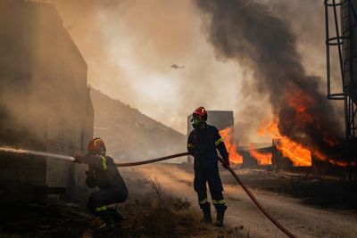 Greece ravaged by wildfires as hundreds of firefighters battle blaze near Athens