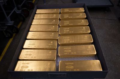 Gold edges higher near two-month peak ahead of US inflation data