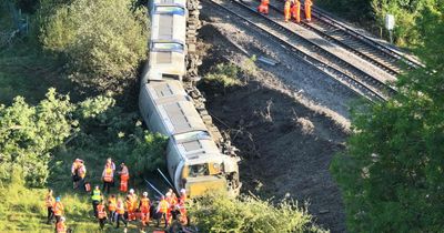 Emergency services at scene of train derailment near Lewes in East Sussex