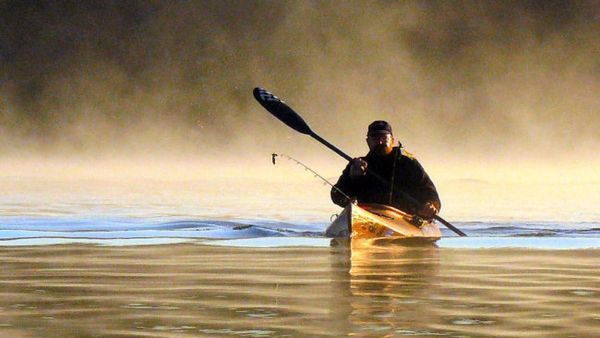 Minnesota man kayaks while fishing on a lake. Then something whizzes through the air and he can’t move his foot