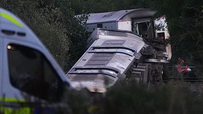 Two injured after train derails in southeast England, emergency services say