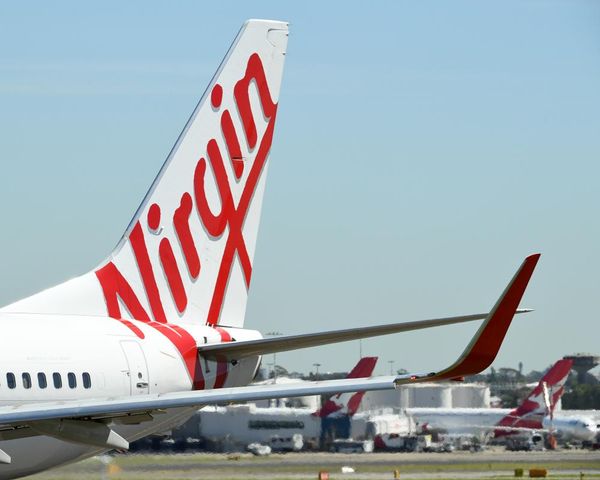 Sydney airport incident involving Virgin and Qantas flights didn’t have to be reported, Airservices Australia says