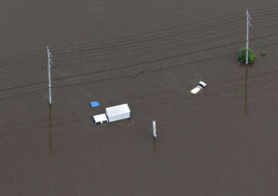 Thousands stranded at Japan's Narita airport after record rain kills four