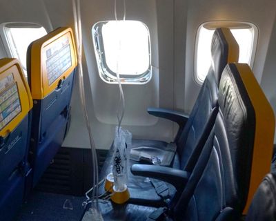 Ryanair window that passenger was partly sucked out of was broken by engine debris, report finds
