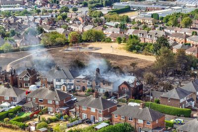 Man and woman arrested over grass fire that damaged four houses