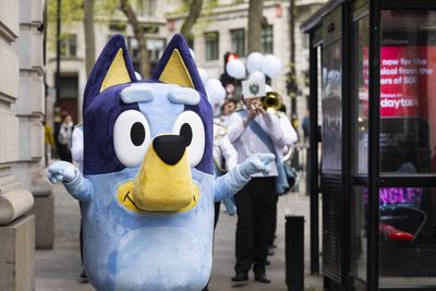 The Bluey Movie first-look trailer shows characters running away as balloon pops