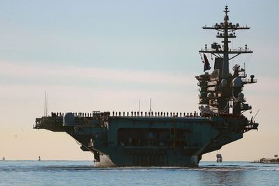 US top Middle East commander visits deployed aircraft carrier, and other Mideast news