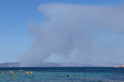 Two dead as fast-moving wildfires sweep Greek island of Salamina with residents preparing to evacuate