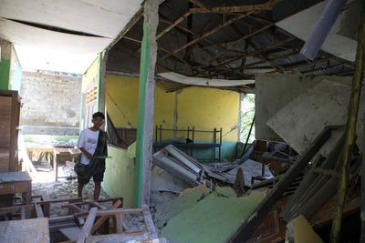 Powerful aftershock hits Indonesian communities still waiting for aid as earthquake death toll rises to 68