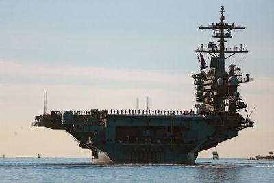 Trump dismisses USS Lincoln criticism and snaps at CNN reporter to ‘be quiet’