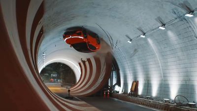 Watch An EV SUV Drive Upside Down In 360° Tunnel Loop