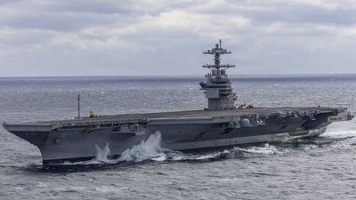 US Navy sailor charged with murder after fellow sailor shot in head on new aircraft carrier, allegedly aimed loaded gun at other sailors 3 other times