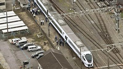Tokyo-bound express train hits and kills four workers at railway station in Japan