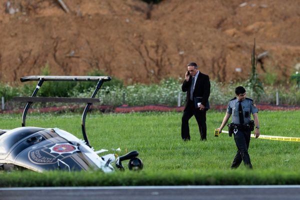 Investigators probe a dramatic midair crash as a landing plane hits hovering police helicopter