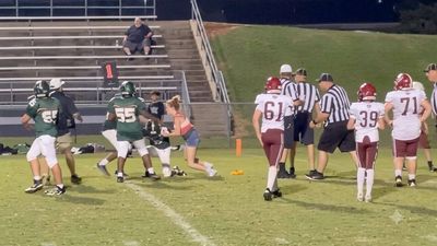 16-year-old ran onto a Tennessee middle-school football field during a scuffle and tackled a player; school district banned her from its properties for life