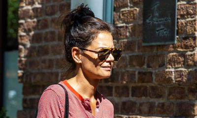 Katie Holmes's comfy wide-leg jeans, striped top and trainers outfit is the answer when the weather can't make up its mind