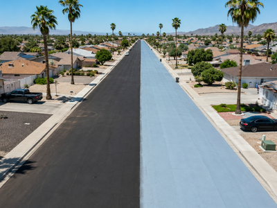 Phoenix swapped black asphalt for a reflective road coating; noon surface heat fell 12°F, but pedestrians faced higher radiant heat