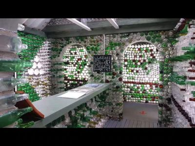 In 1979, Canadian fisherman Édouard Arsenault got a postcard from his daughter that inspired him to build an entire village from more than 25,000 recycled glass bottles
