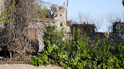 In 1959, a California teenager began building a castle from bottles, car parts and scrap metal; decades later, it had towers and a giant clock