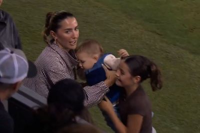 Toddler halts soccer game after wandering onto field
